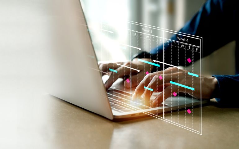 Project management concept , analyst working with computer in management system to make report with KPI and metrics connected to database.