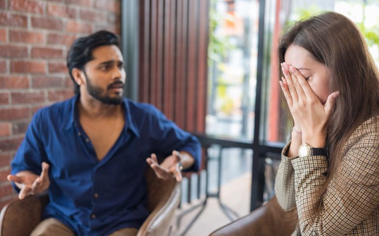 Young couple arguing while having problems in their relationship.