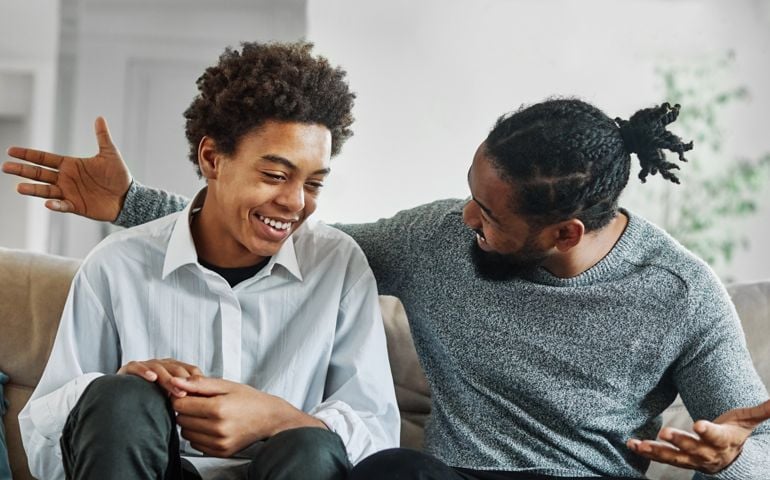 father son family man child conversation talking parent boy happy discussion communication together togetherness bonding care black home talk love dad fun leisure joy