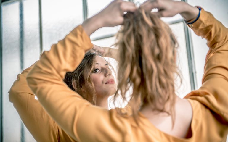 Redhead Woman Looking at Herself in Mirror, Paris, France