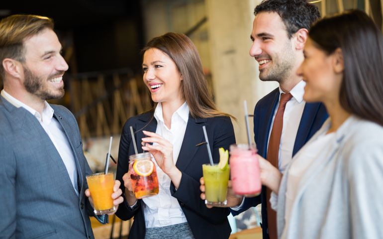 Business team taking a break and drinking healthy smoothies
