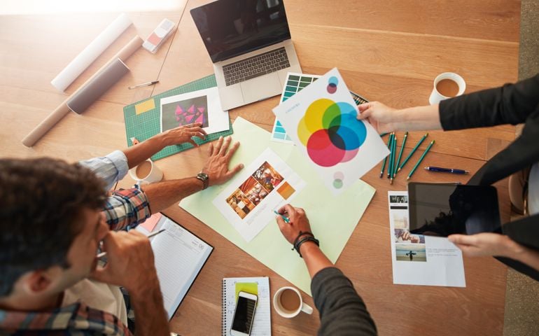 Young designers discussing the color palette