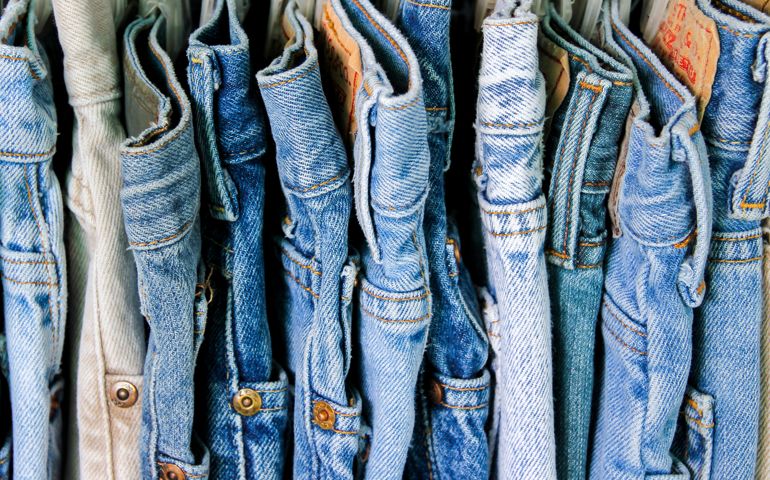 A rack of second hand jeans