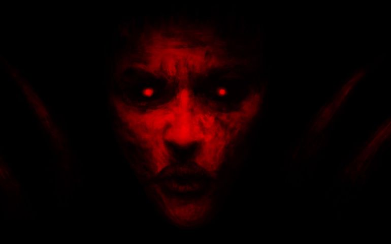 Devilish woman appears from dark and kisses.
