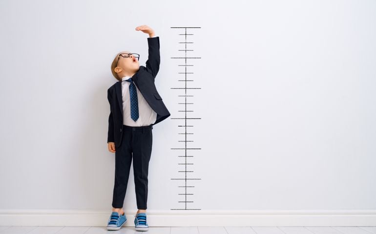 Kid is measuring the growth
