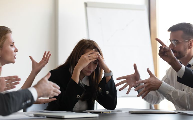 Frustrated millennial female worker felling tired of working quarreling.