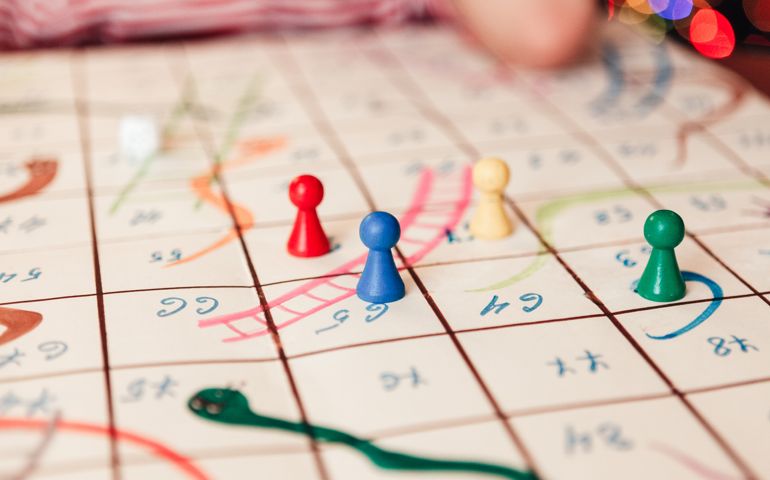 Hand-drawn game Snakes and Ladders. Close-up.