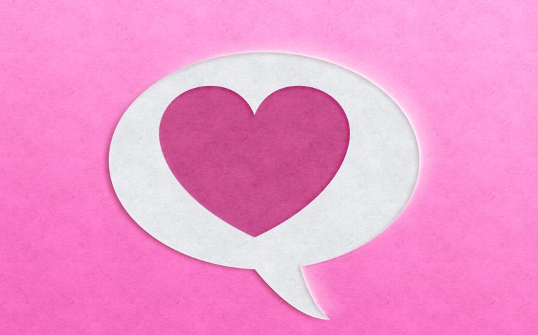 speech bubble with pink heart shape