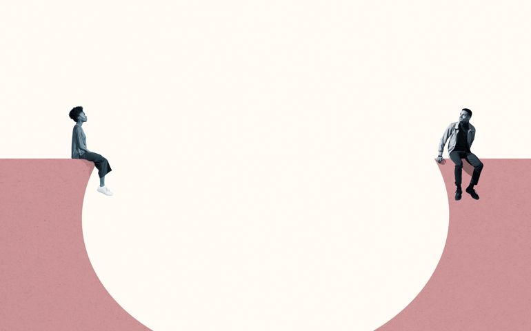 Man and woman sitting around large thought bubble