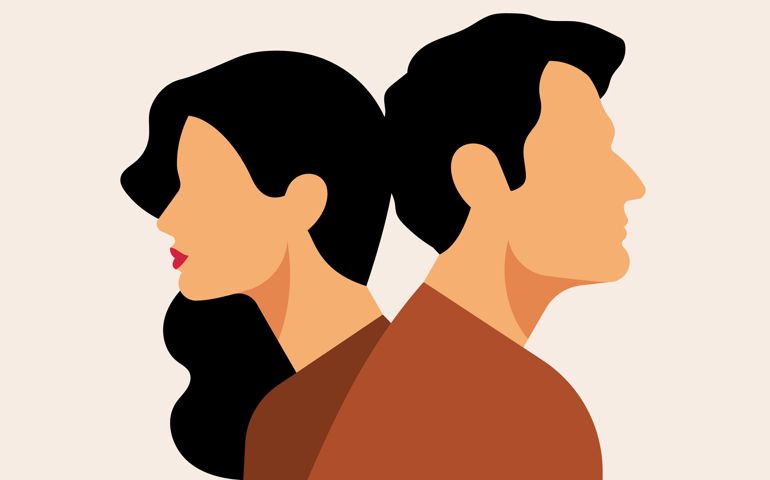 Unhappy couple having conflict. Young caucasian man and caucasian woman turned away from each other.