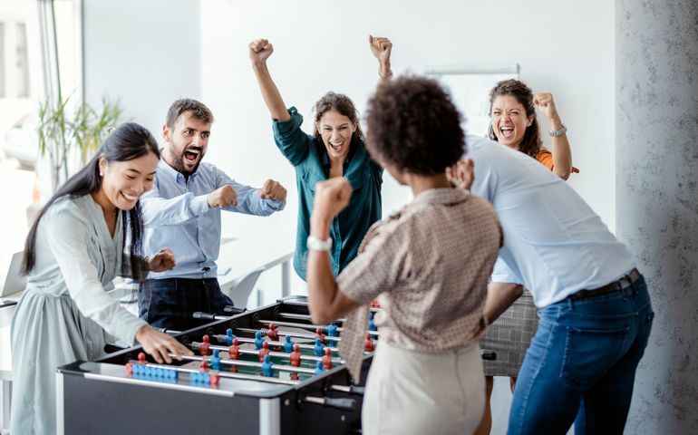 Coworkers Playing Table Football