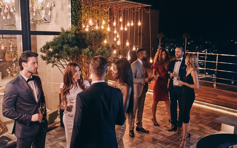 Group of people in formalwear communicating and smiling