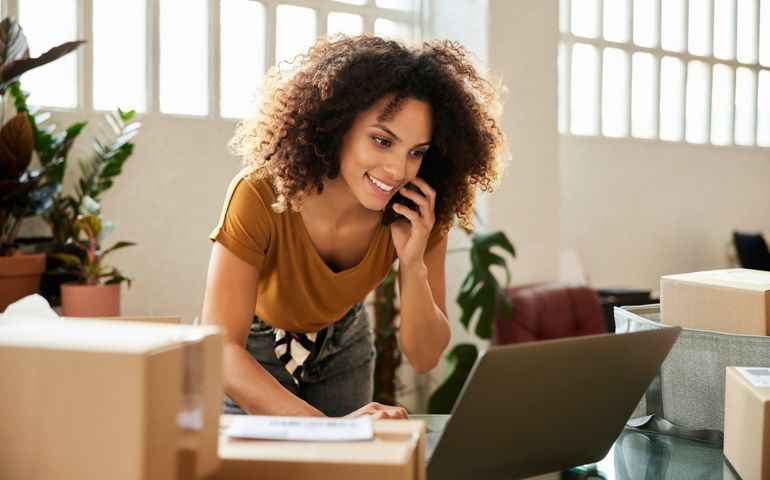 Entrepreneur Using Laptop At Home Office