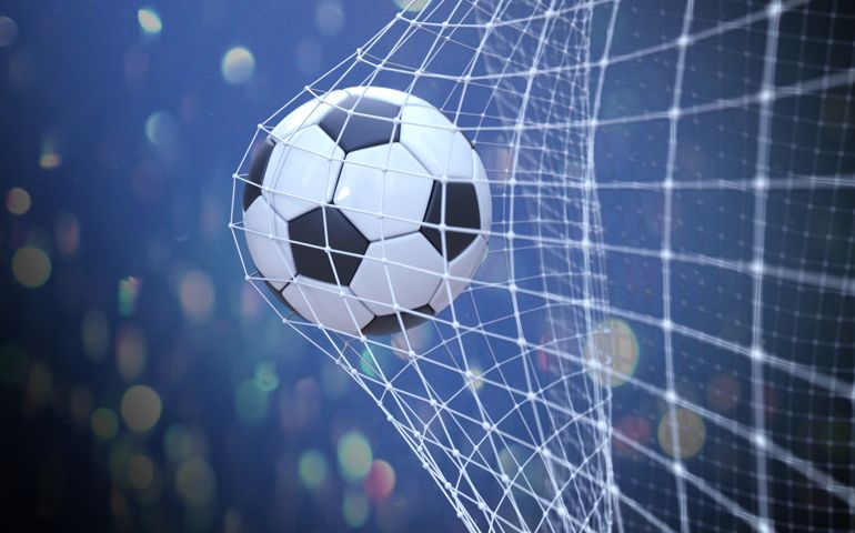 Soccer Ball In Goal With Fans