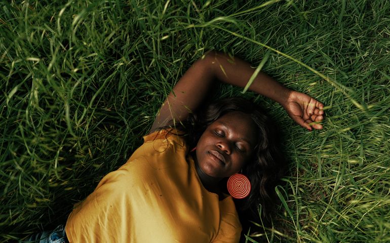 Woman daydreaming on a meadow