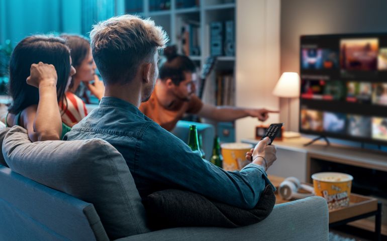 Friends watching movies together at home