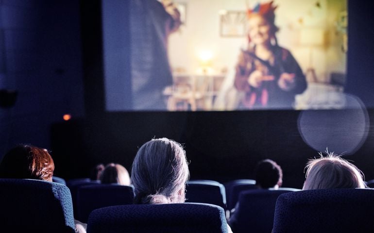 Watching Movie In Cinema