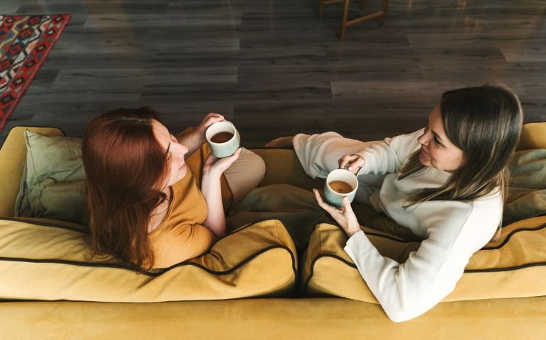 Two women are sitting and talking