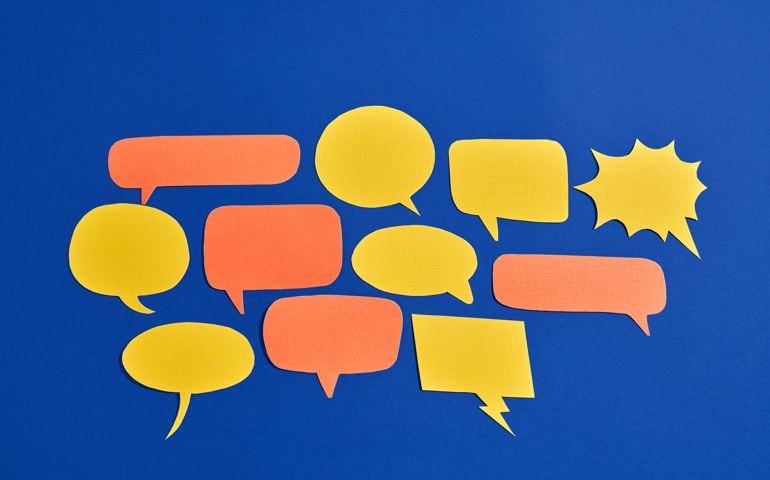 Many Orange And Yellow Comic Bubbles On Blue Background