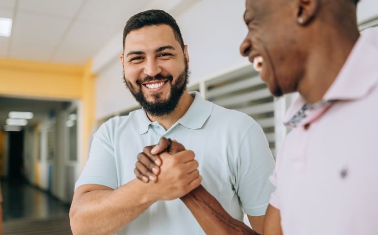 Partner friends shaking hands