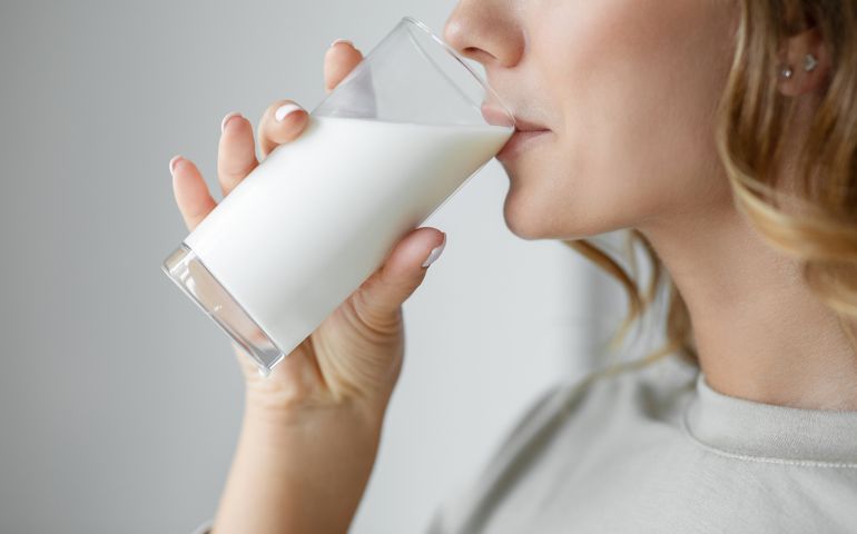 Woman drinking a glass of milk