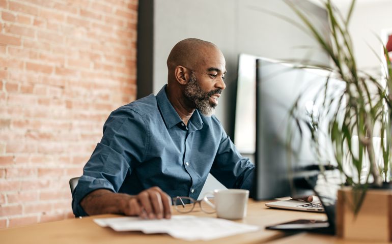 man on computer