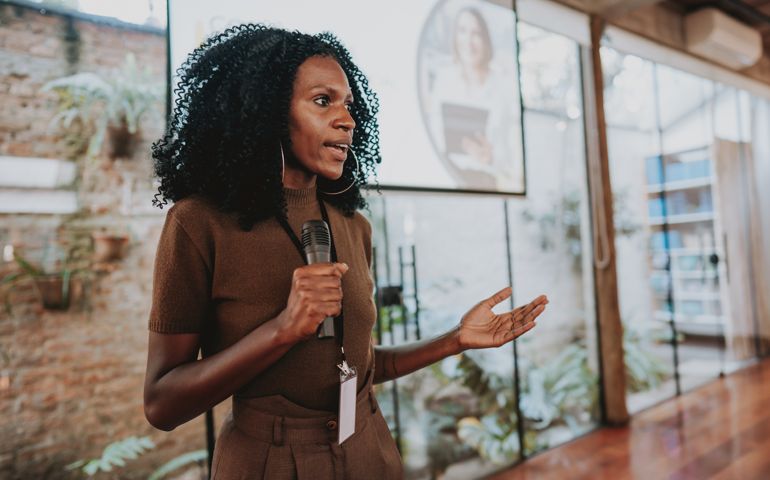 Woman giving speaker presentation