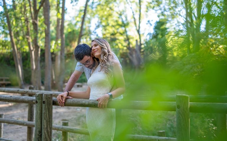 Couple in love enjoying a walk in the woods at sunset