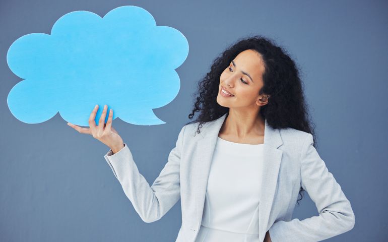 Speech bubble, mockup and news icon by businesswoman thinking for social media, product placement. Vote, opinion and corporate employee with voice and happy isolated in studio blue background