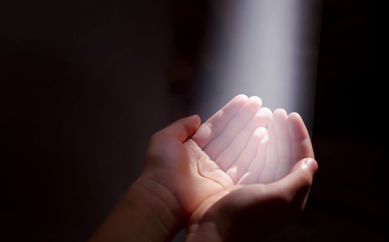 light beam and hands