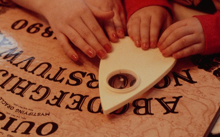 Children Play with Ouija Board
