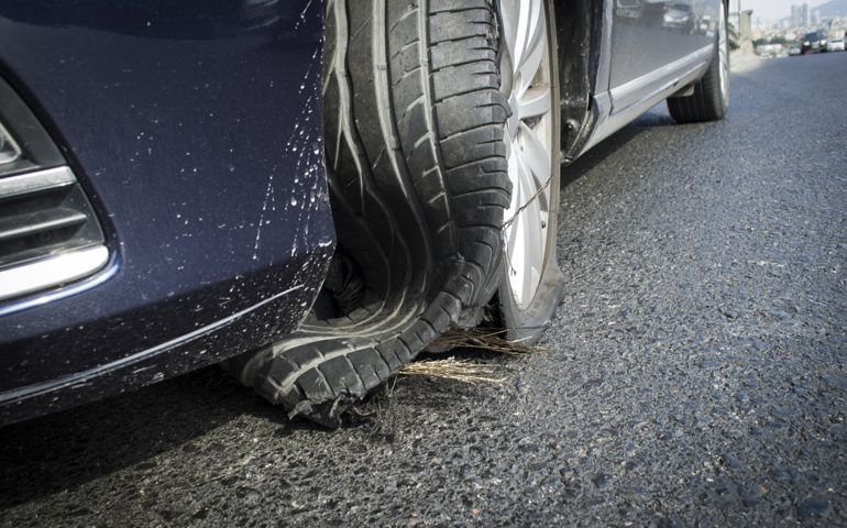 damaged tire after tire explosion at high speed on highway