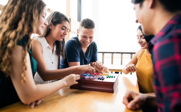 Young people enjoyig time with a boardgame