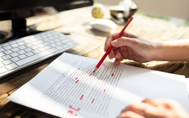 persons hand with red marker