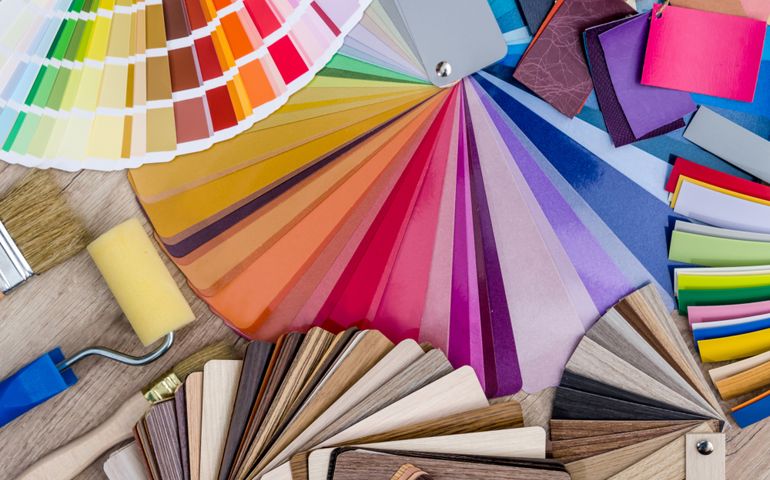 Different colour swatches with paintbrush and roller