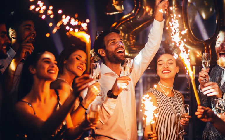 Group of friends celebrating with champagne