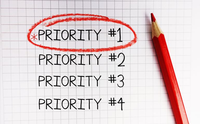 Number one priority marked with red circle on math notebook