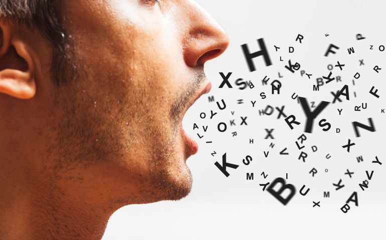 close up of a young man speaks - words power - watch your words concept
