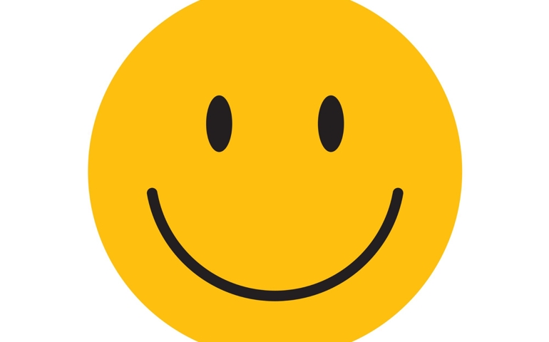 Yellow happy face with smile.