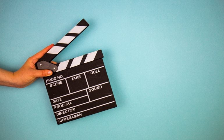 Movie clapper on blue background, cinema concept