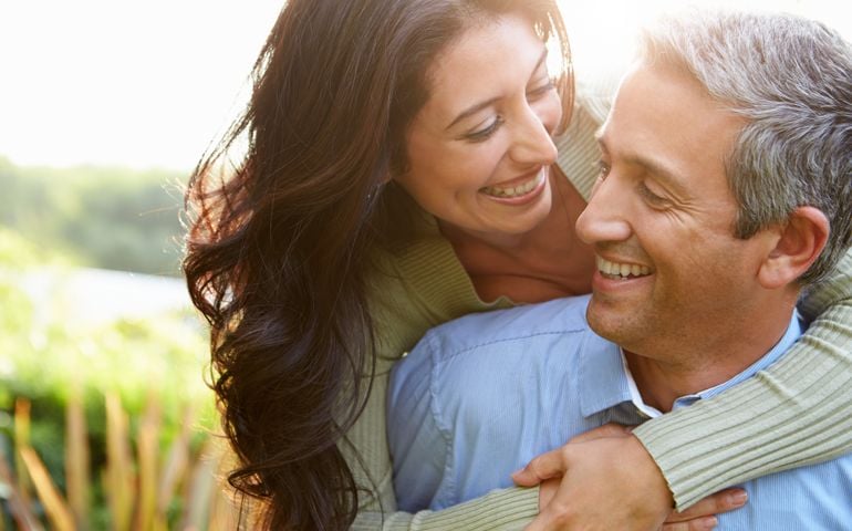 Loving Hispanic Couple In Countryside
