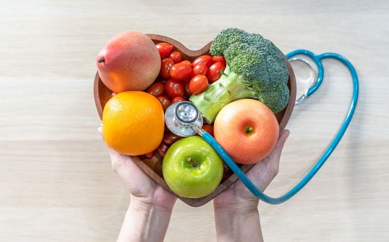 Nutritional food for heart health wellness by cholesterol diet and healthy nutrition eating with clean fruits and vegetables in heart dish by nutritionist and doctor recommended for patient well-being