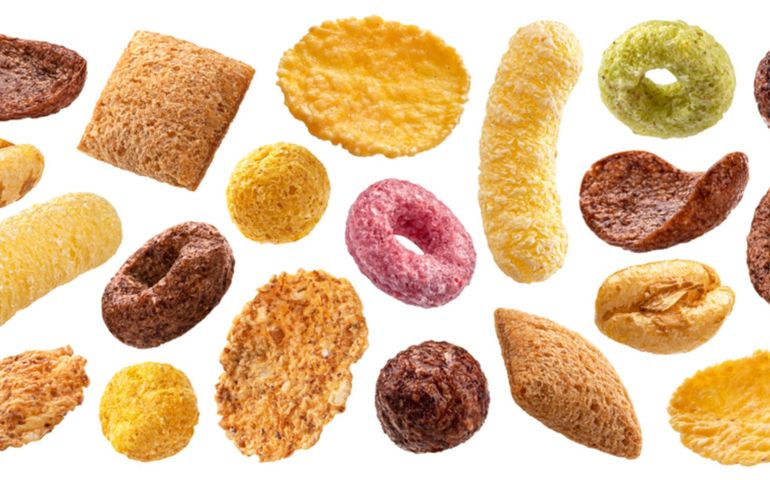 Different types of breakfast cereals isolated on white background, sweet cornflakes, chocolate pads and rings, puffed rice and wholegrain flakes collection
