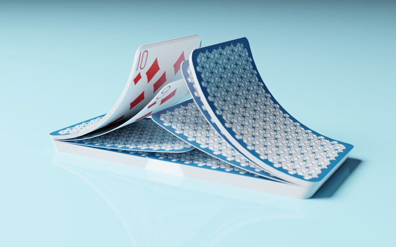 close up of 3d rendering shuffle playing card motion over light blue background. 3d illustration