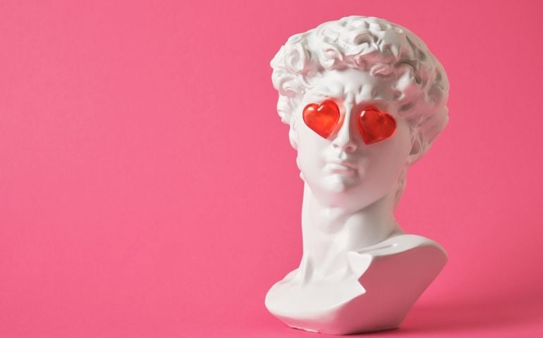 fake bust of david with red glass hearts on the eyes, love concept