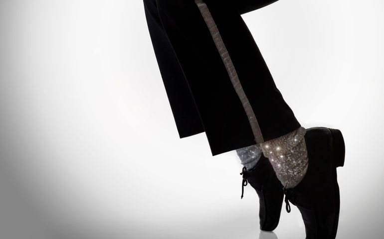dancer move. standing on the feet fingers in a power freeze move