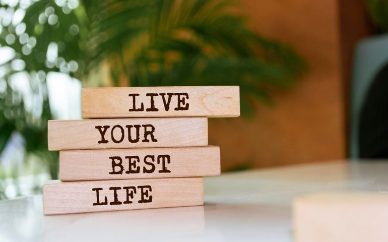 Wooden blocks with words 'Live Your Best Life'.