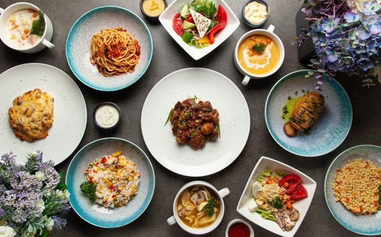 Assortment of dishes. Many dishes. Salads, soups, side dishes