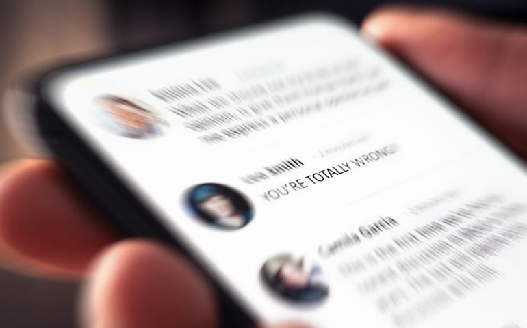 Controversy, online anger and troll or hate comment on social media. Debate, fight and bad dialog on news feed.