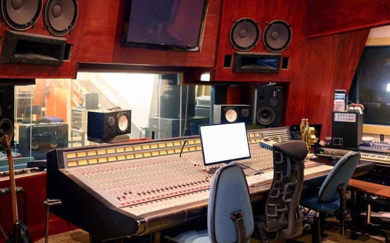 Music, studio and technology with recording equipment in an empty room for the entertainment industry. Interior, creative and audio with musical electronics to produce, record or control sound